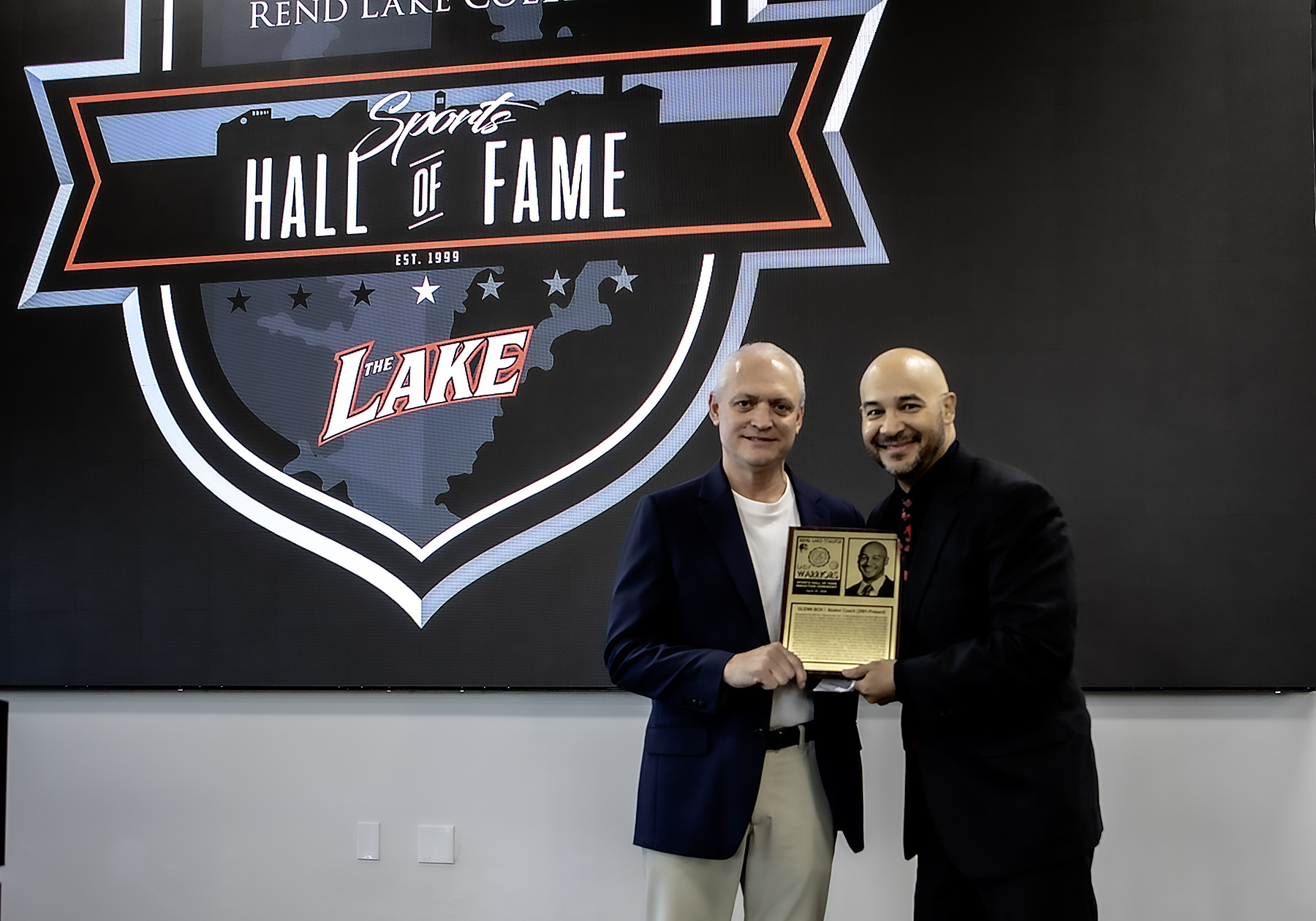 Tim Wills presents Glenn Box his Hall of Fame plaque